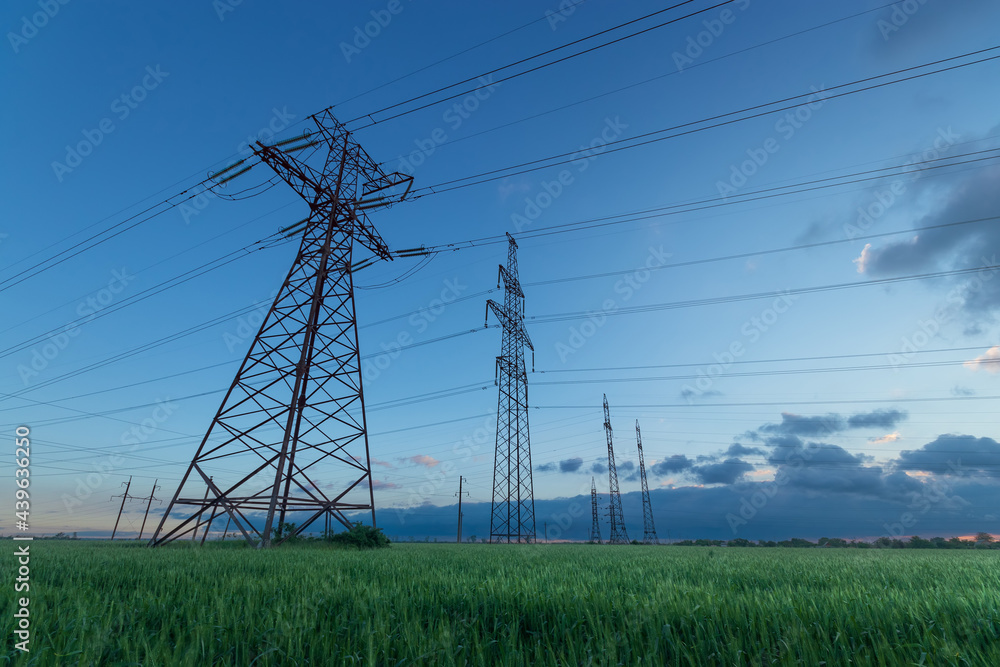 power line , outdoor on a green field power line , outdoor on a green field