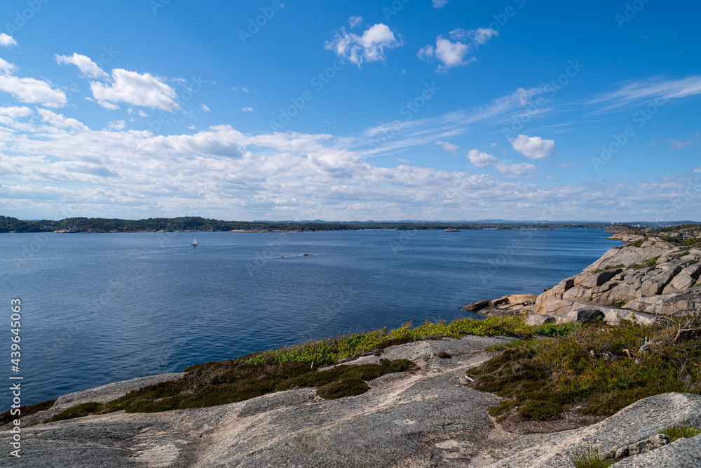 the beautiful coast of norway with its rock formations and blue water on a beautiful summer day the beautiful coast of norway with its rock formations and blue water on a beautiful summer day