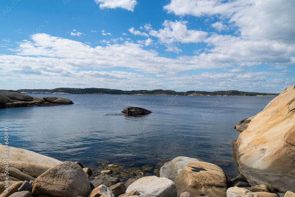 the beautiful coast of norway with its rock formations and blue water on a beautiful summer day