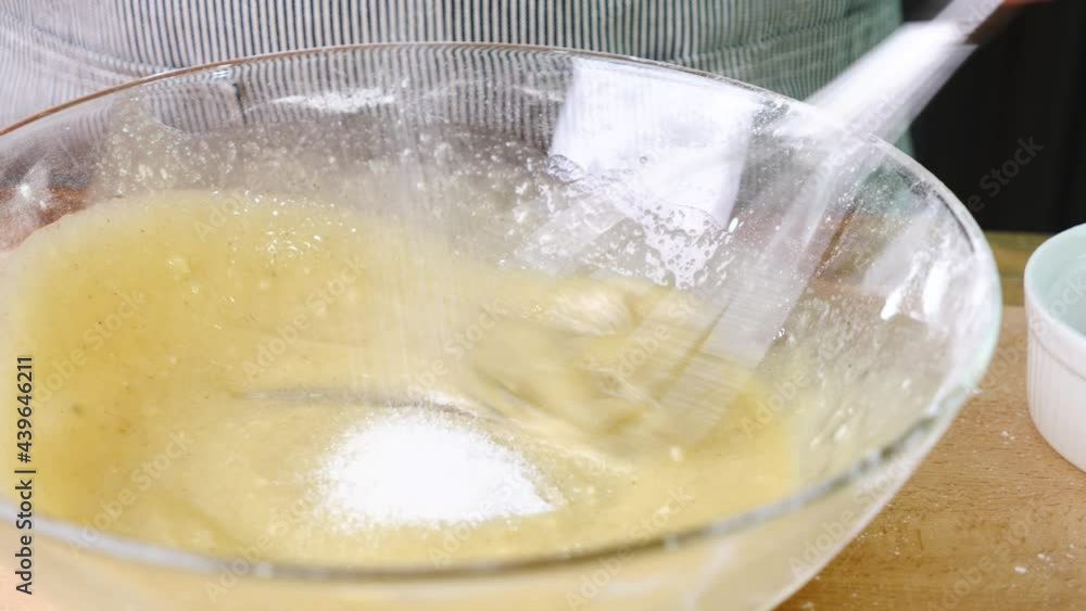 girl making cakes or cookies. She is mixing all the ingredients together. girl making cakes or cookies. She is mixing all the ingredients together.