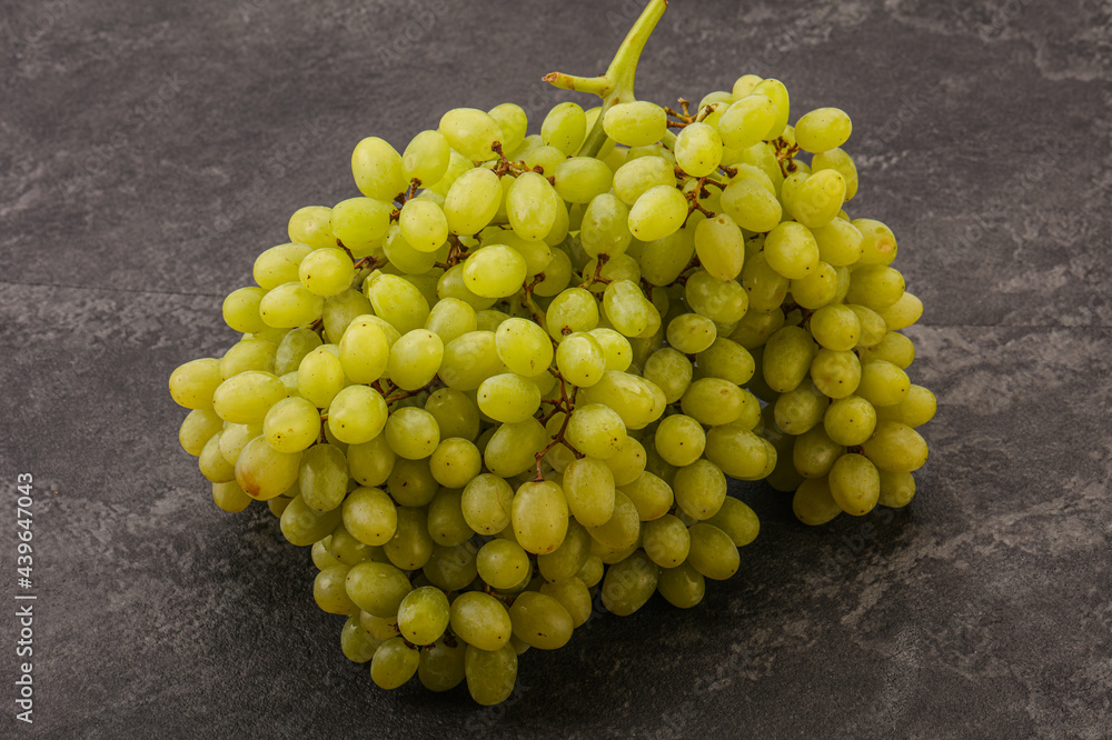 Green grape branch over background Green grape branch over background