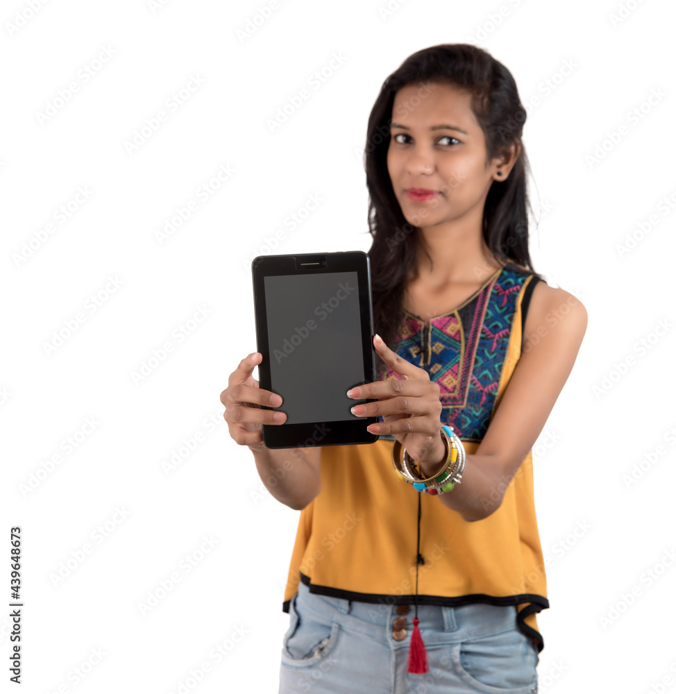 Young beautiful woman holding blank screen smart phone on white background Young beautiful woman holding blank screen smart phone on white background