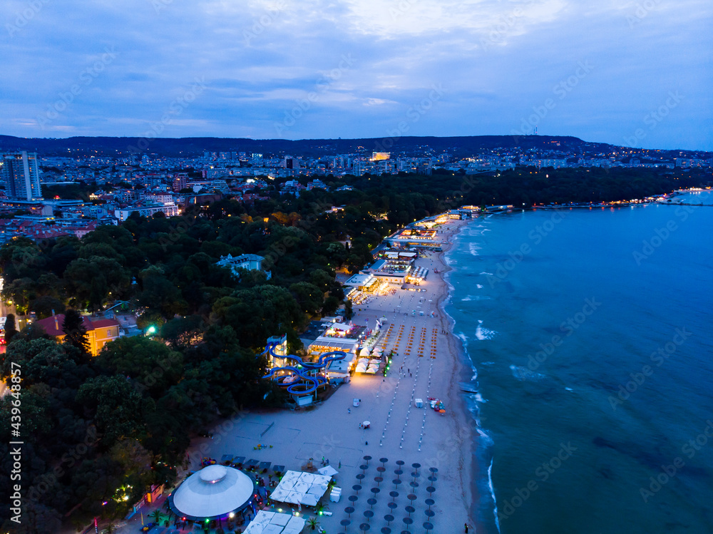 View from above of the hotels in night Varna in Bulgaria. Summer holiday in Europe. Aerial photography, drone view. - obrazy, fototapety, plakaty 