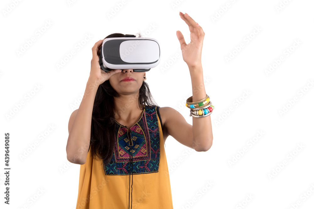 Beautiful girl looking though VR device. Young girl wearing virtual reality goggles headset. Beautiful girl looking though VR device. Young girl wearing virtual reality goggles headset.