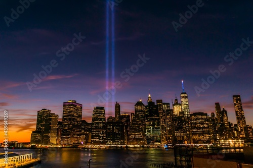 Tribute in Light shines high over Lower Manhattan at Dusk