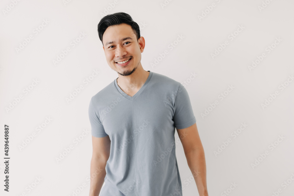 Portrait of happy Asian man in blue t-shirt isolated on white background. Portrait of happy Asian man in blue t-shirt isolated on white background.