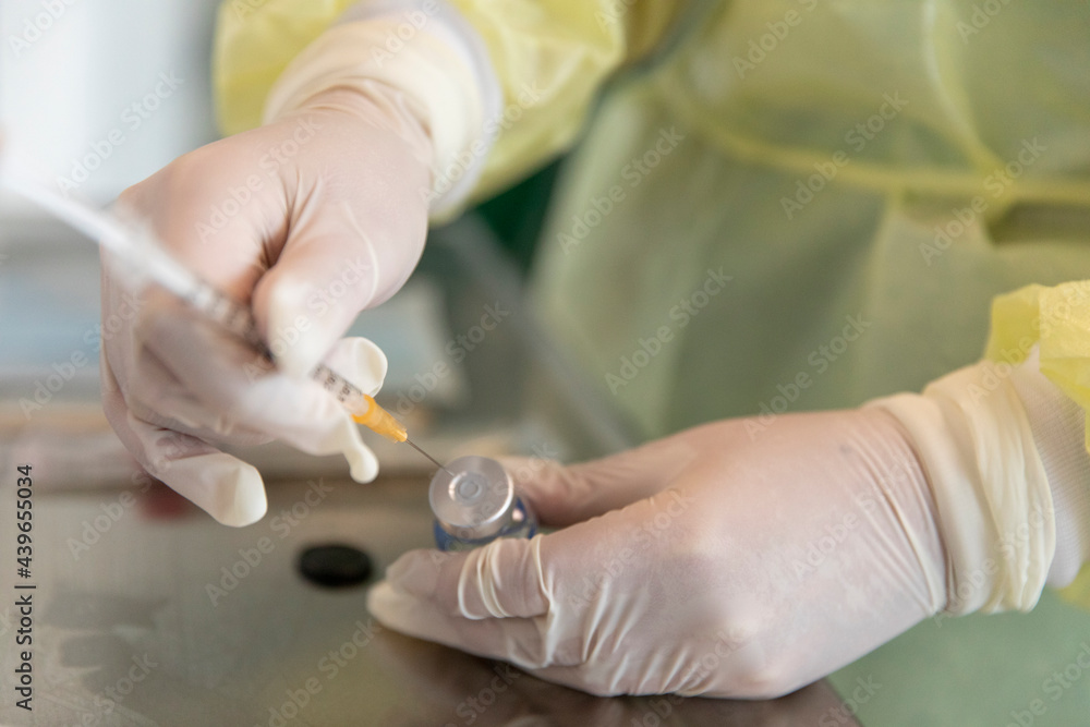 A vaccine and a needle A vaccine and a needle