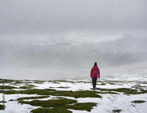 Walking in heavy snow on Wild Boar Fell, Cumbria, UK. photo