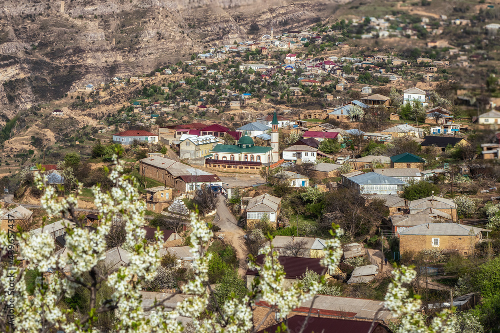 Mosque in the center of a mountain village. Landscape and countryside of cityscape in Goor. Dagestan.