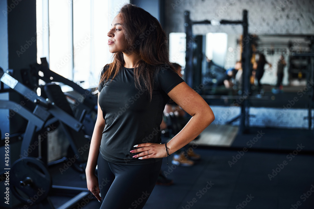 Relaxed fit woman working as trainer in gym Relaxed fit woman working as trainer in gym