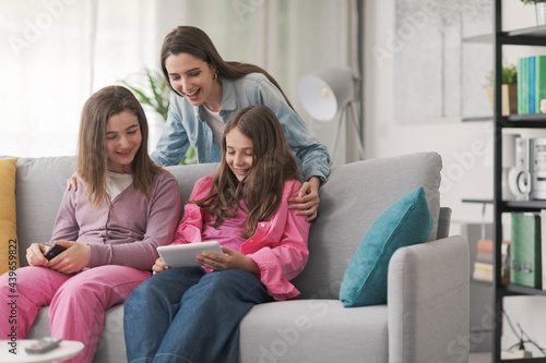 Mother and kids watching videos online together