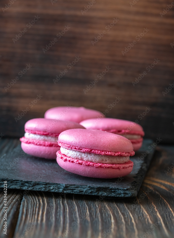 Macarons on the black stone board Macarons on the black stone board