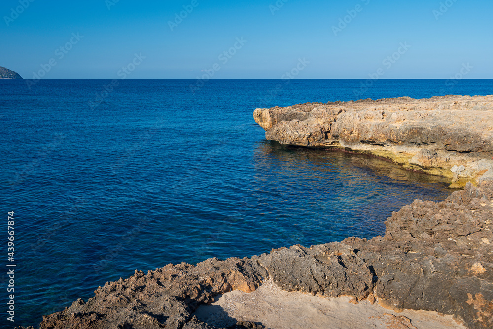 The coast of the Punta de n’Amer peninsula on Mallorca island in Spain