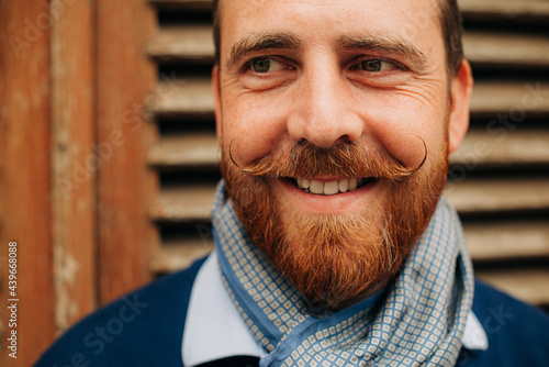 Headshot of a bearded man with moustache photo