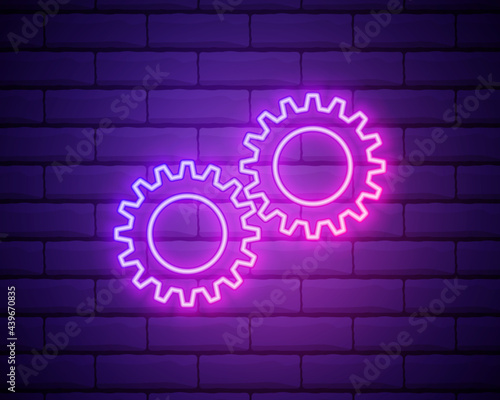 Gear, maintenance. Pink neon vector icon. Glowing gear symbol isolated on brick wall background