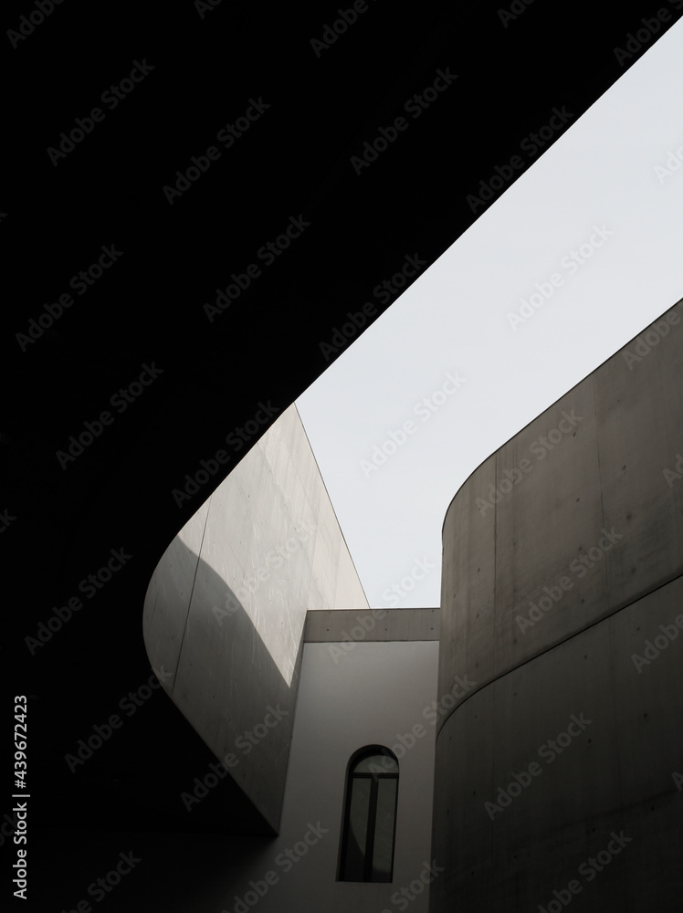 © Marco Reggi/Stocksy - contemporary and minimal architecture building © Marco Reggi/Stocksy - contemporary and minimal architecture building
