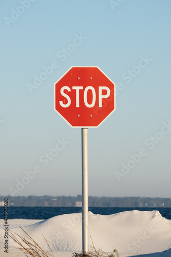 Red Stop Sign at the Beach
