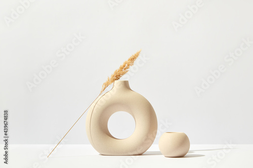 Twig on beautiful ceramic vase photo