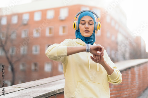 Muslim Runner Using Smart-watch photo