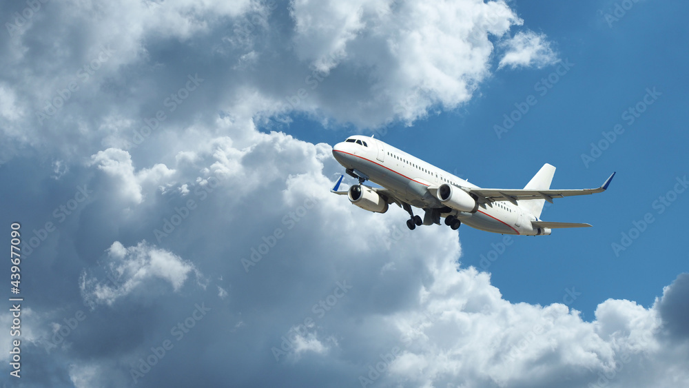 Zoom photo of passenger plane flying above deep blue cloudy sky Zoom photo of passenger plane flying above deep blue cloudy sky