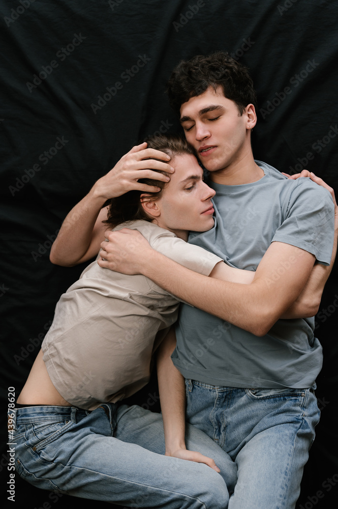 Boyfriends resting on bed with closed eyes Boyfriends resting on bed with closed eyes