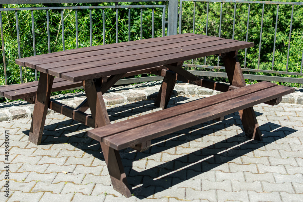 Fototapeta premium two wooden tables on a playground area