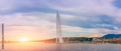 The Jet d'eau foutain, View on famous big fountain on geneva lake leman Jet d'eau at sunrise sunset, Switzerland photo