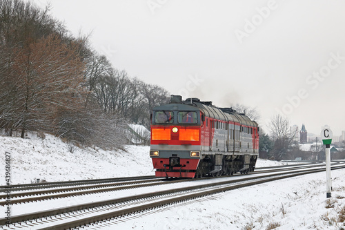 powerful diesel locomotive without wagons moves to the railway station