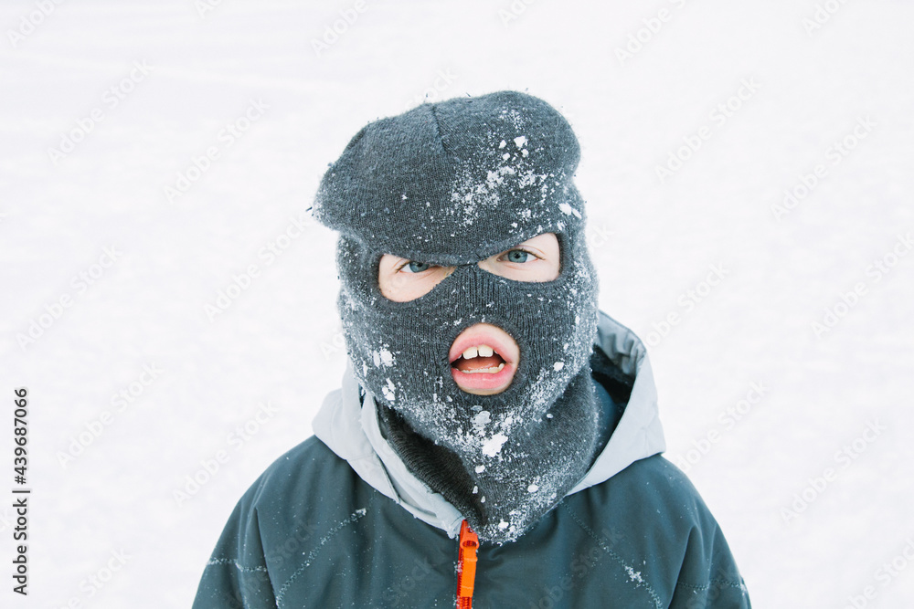 Tired Boy in Winter Ski Mask Tired Boy in Winter Ski Mask