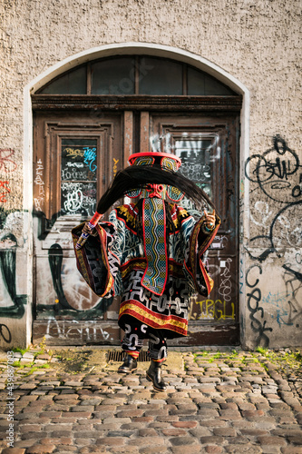 Extravagant African tribal dance in an urban setting photo