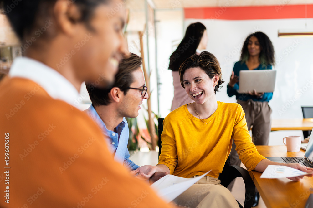 Coworkers Chatting In Modern Office Coworkers Chatting In Modern Office