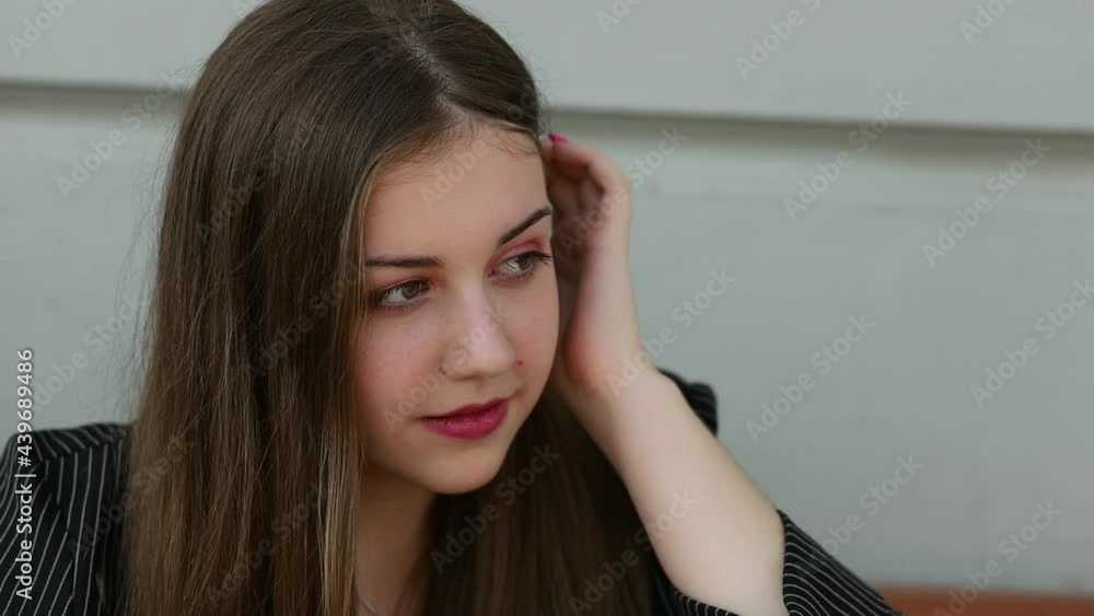 The girl puts on sunglasses, Close-up The girl puts on sunglasses, Close-up