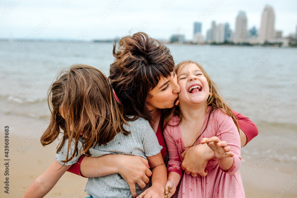 Mother with happy daughters at beach Mother with happy daughters at beach