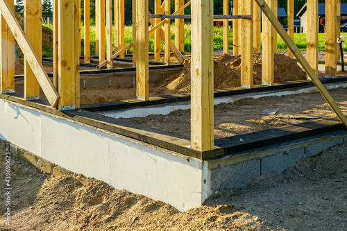 simple wooden frame building base construction, foundation waterproofing photo