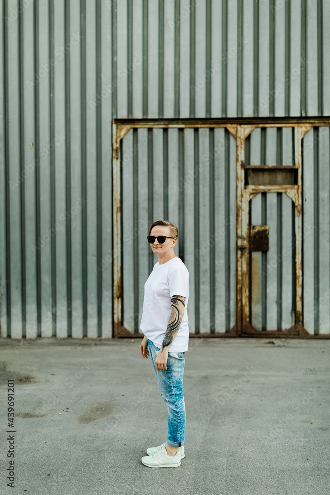 Androgyne woman with short hair outdoors Androgyne woman with short hair outdoors
