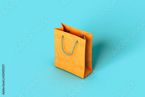 Orange paper bags on blue background