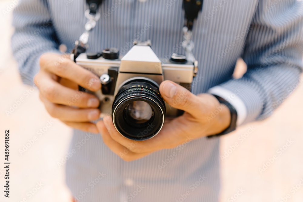 anonymous man holding in hands retro camera anonymous man holding in hands retro camera