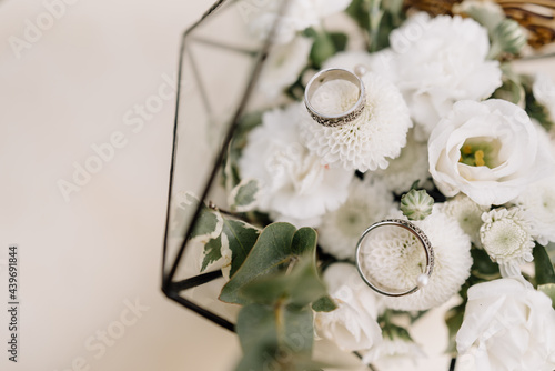 Wedding rinds on white flowers photo