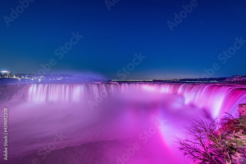 Niagara waterfall at night with vivid colors in winter