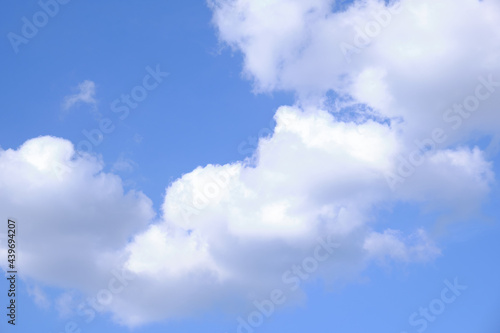 Blue Sky and puffy clouds. Background From Clouds. © roberjzm