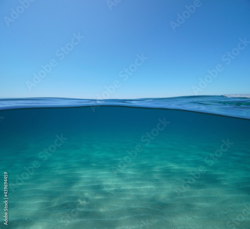 Blue sky with sand underwater sea, split view over and under water surface, Mediterranean sea © dam
