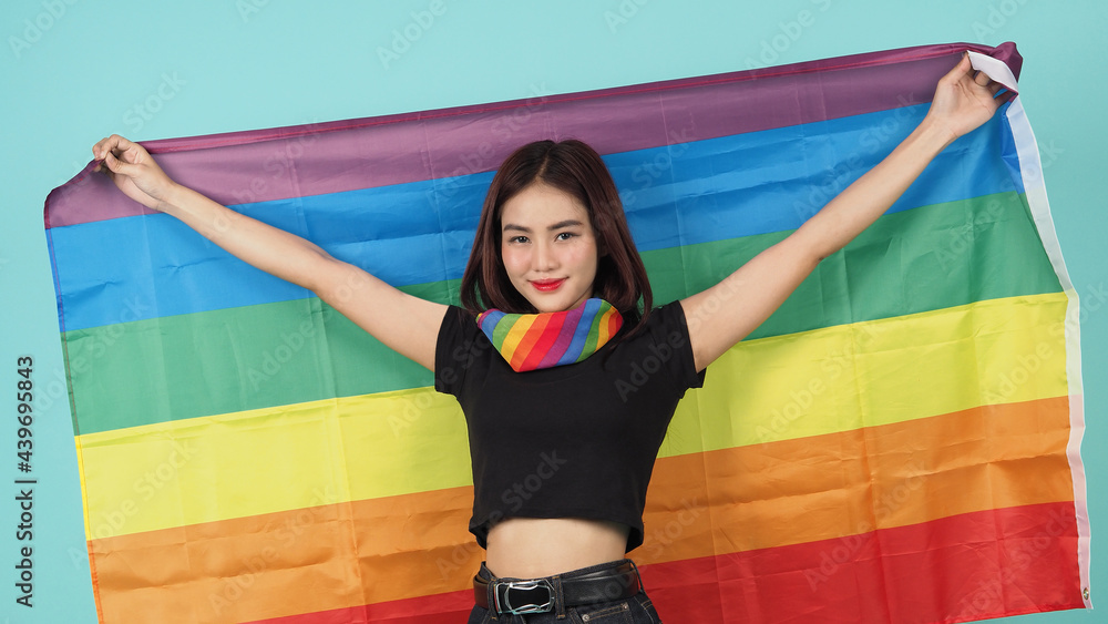 LGBTQ girl and pride flag. Sexy Lesbian girl and LGBTQ flag standing ...