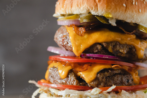 Close-up of Mouth-Watering Burger On Wooden Board.