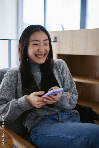 Happy woman using phone 