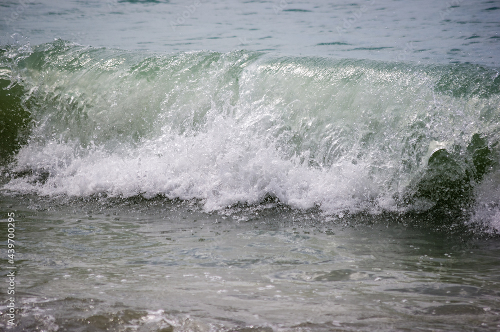 sea landscape is a pebbly beach with waves in white foam sea landscape is a pebbly beach with waves in white foam
