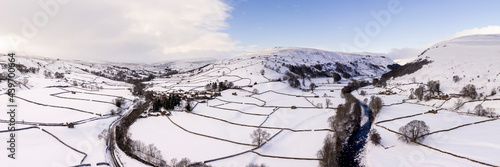 Swaledale Muker and thwaite covered in snow in winter aerial North Yorkshire Dales England photo