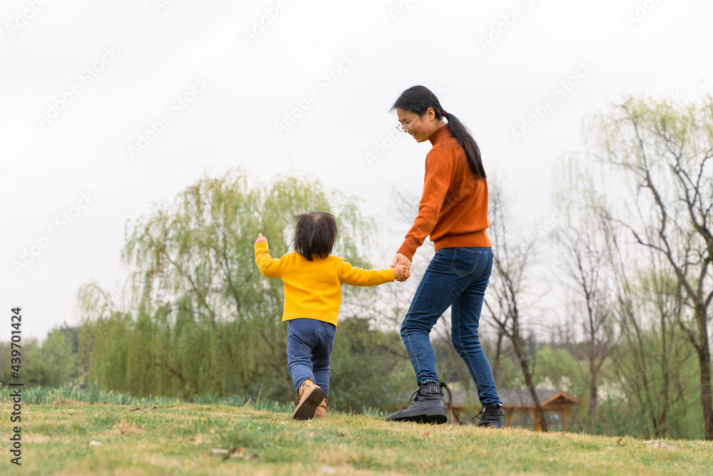 lovely asian baby girl running on the lawn lovely asian baby girl running on the lawn
