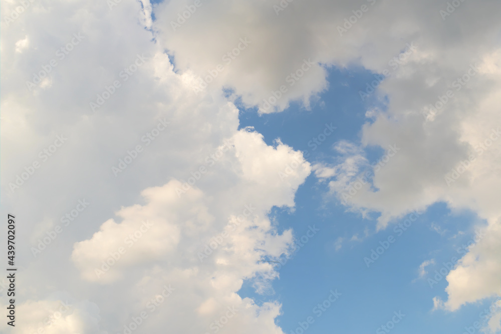 Fluffy white clouds on a blue sky