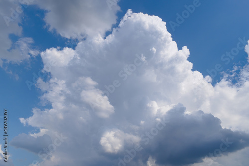 Fluffy white clouds on a blue sky