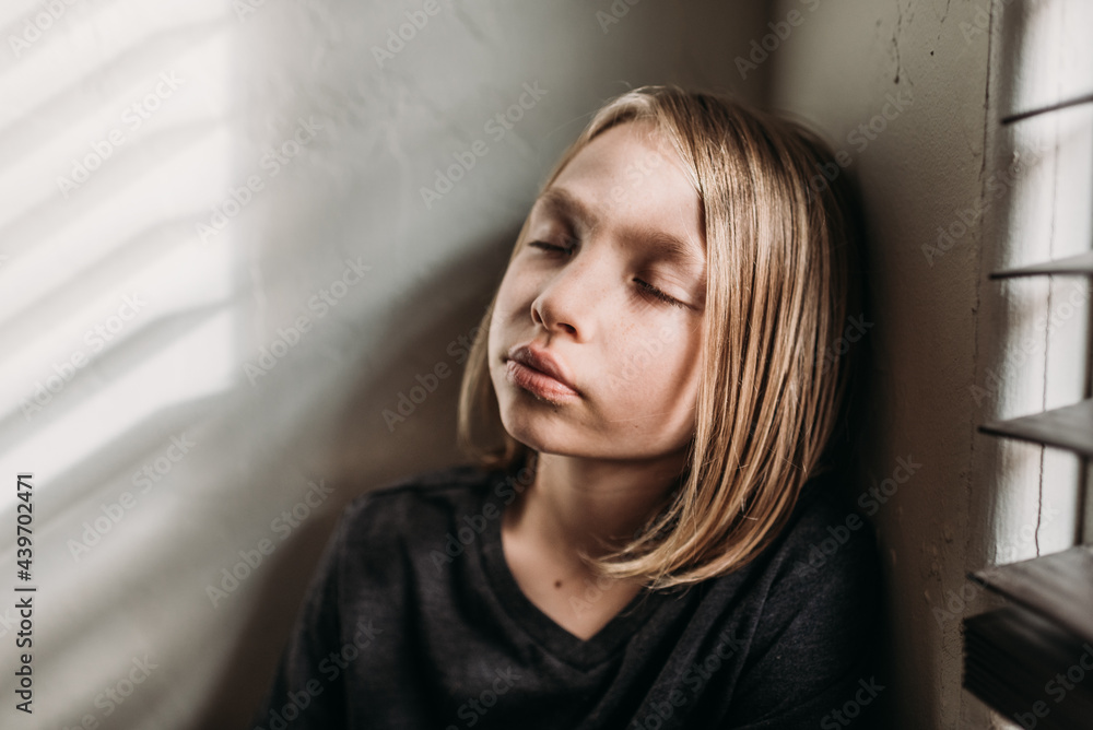 Young boy meditating at home Young boy meditating at home